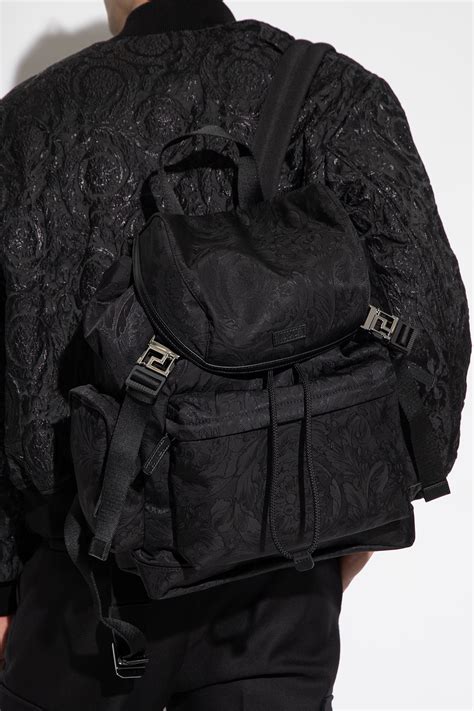 Versace with backpack